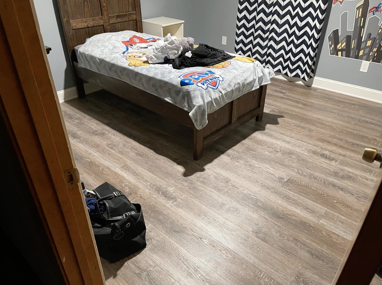 1,400 sq ft LVP flooring with new baseboards installed in Canton, GA home by Concept Flooring