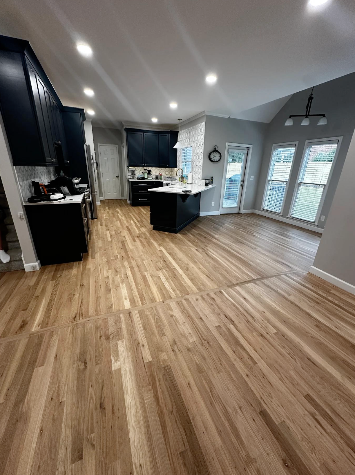 New White Oak hardwood blended into refinished main level floors in Marietta, GA by Concept Flooring