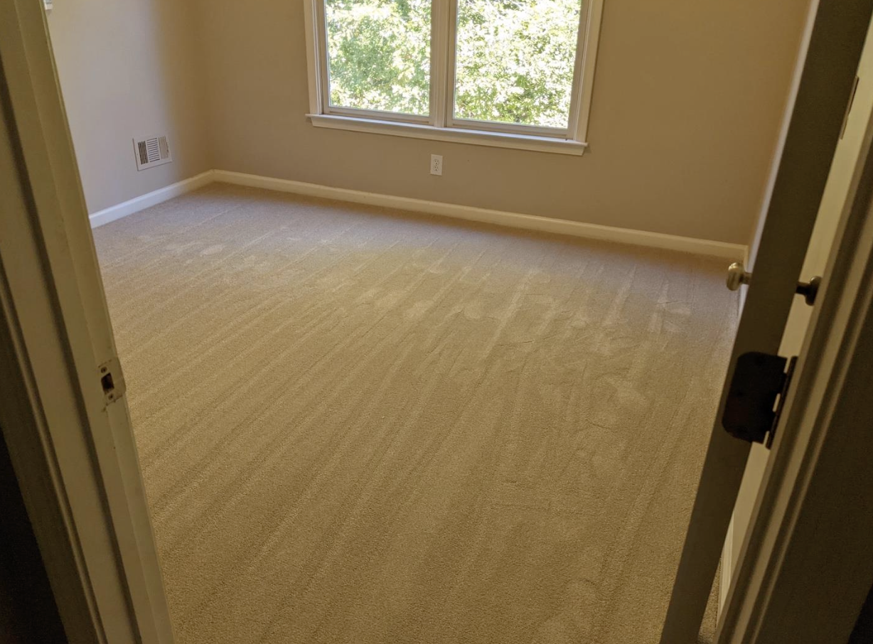 Five rooms of solution-dyed carpet with moisture barrier installed in Canton, GA by Concept Flooring