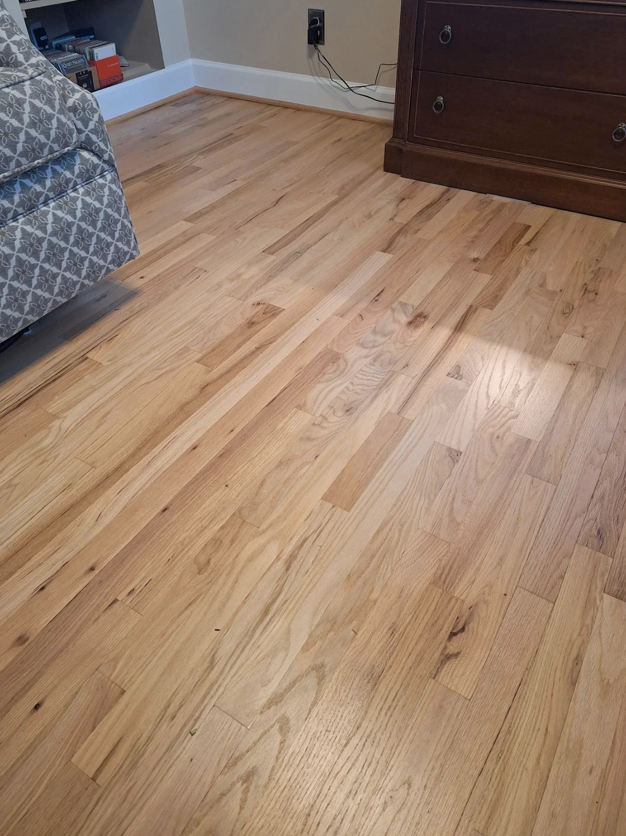 Hardwood floors refinished to natural satin finish with 14 stair treads in Woodstock, GA by Concept Flooring
