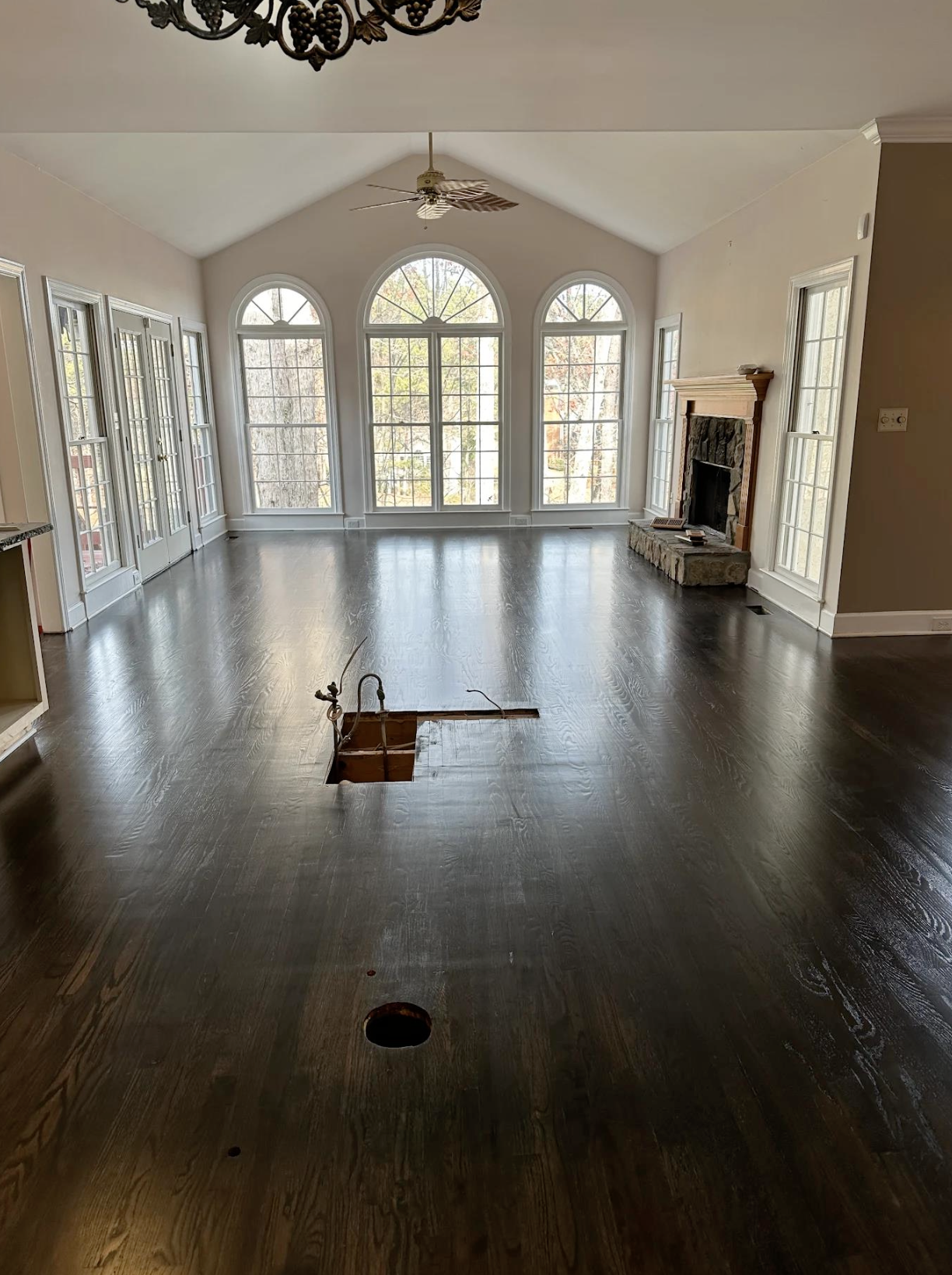 Kitchen remodel hardwood patch and full refinish blended throughout in Woodstock, GA by Concept Flooring