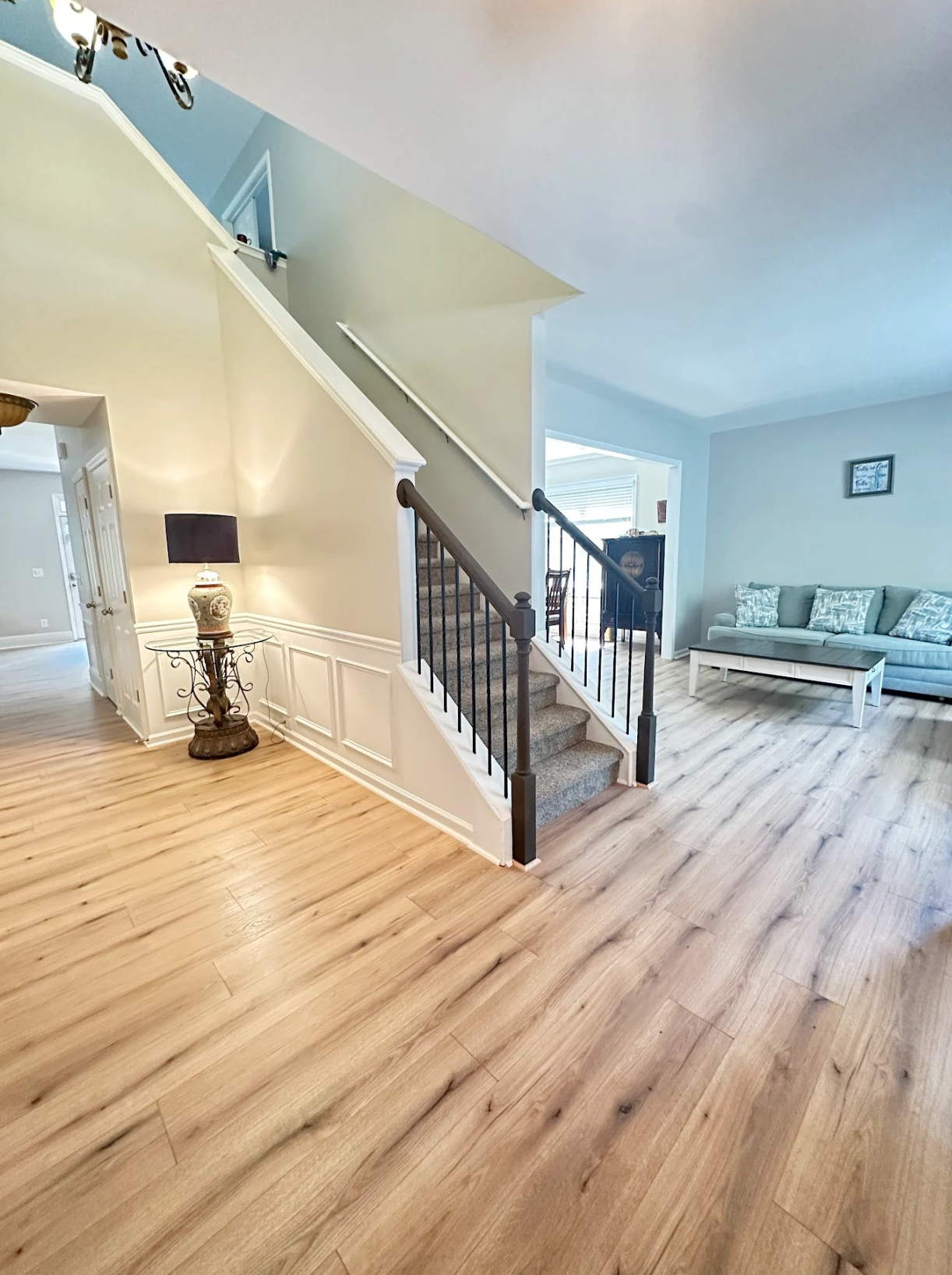 Main level laminate and upper level carpet installed in Canton, GA by Concept Flooring