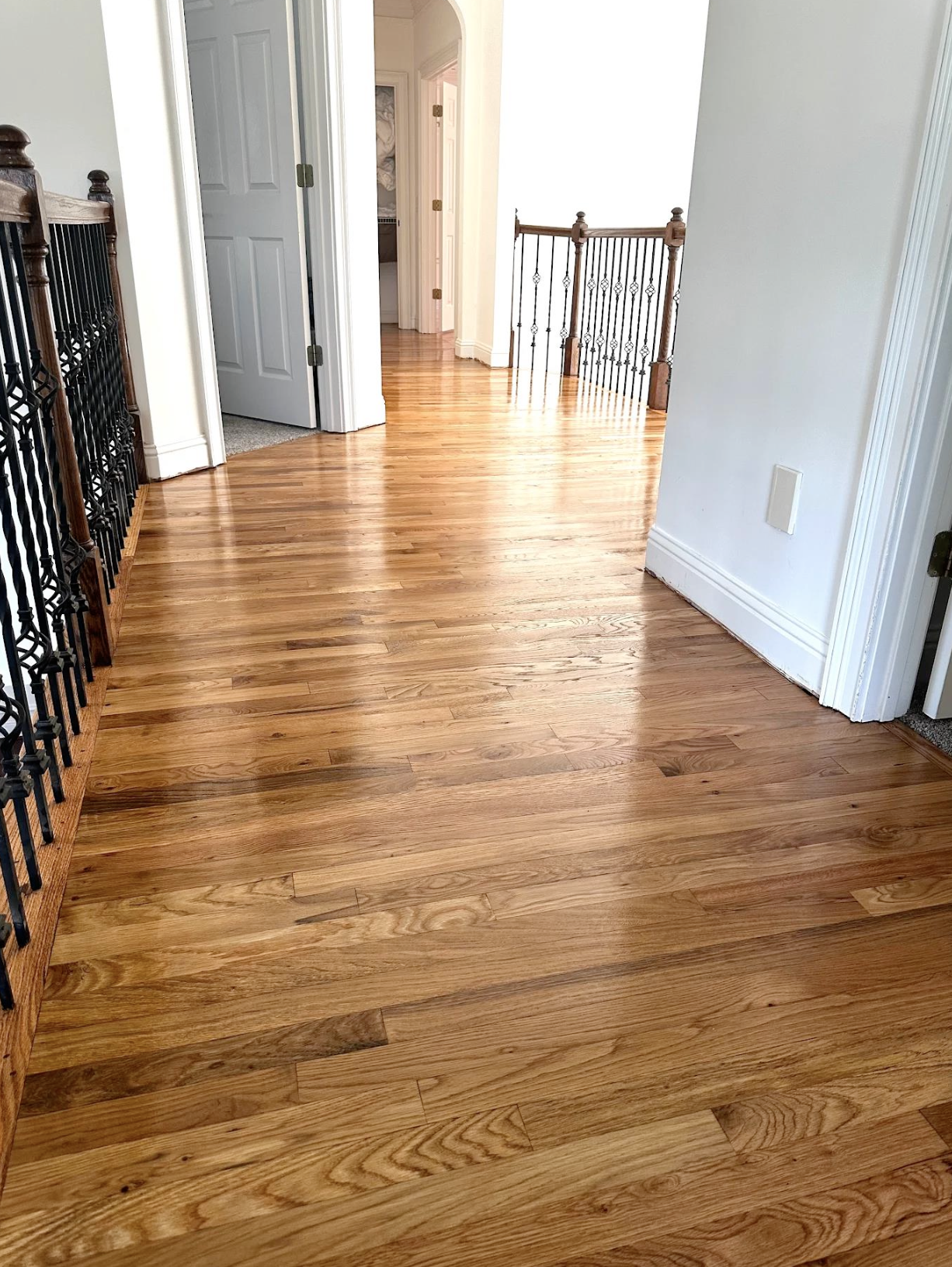 2.25-inch site-finished Red Oak hardwood and hallway refinishing in Kennesaw, GA by Concept Flooring