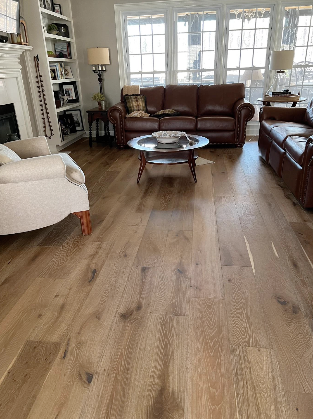 Shaw wide-plank engineered hardwood and Anderson Tuftex runners on three staircases in Kennesaw, GA by Concept Flooring