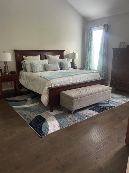 Shaw prefinished handscraped engineered hardwood glued down in Roswell, GA master bedroom by Concept Flooring