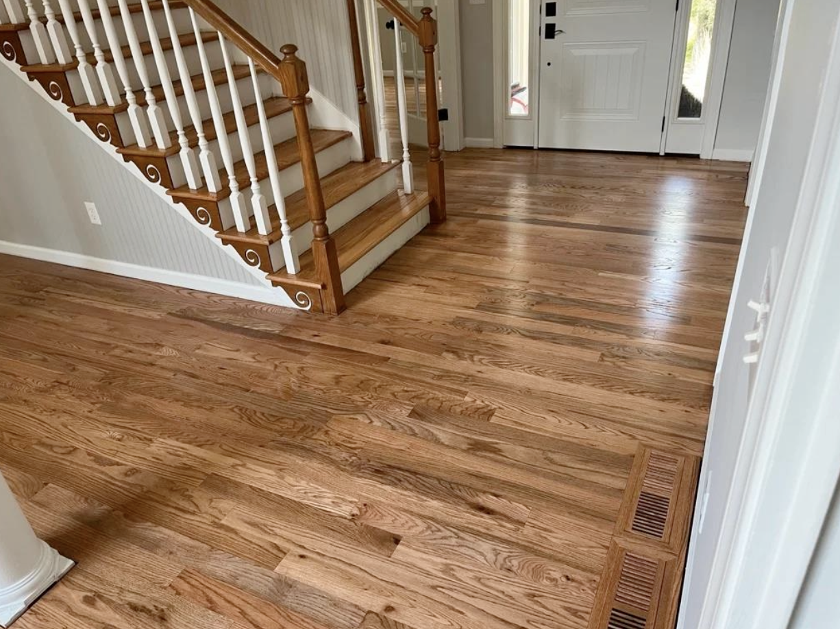 New site-finished hardwood and refinished existing floors with stair treads in Cumming, GA by Concept Flooring