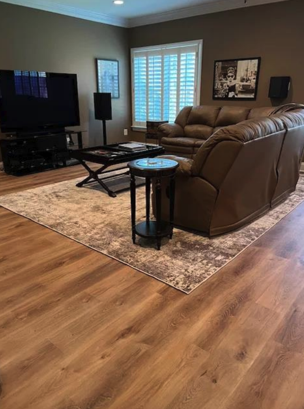 Luxury vinyl plank, carpeted stairs, and new hardwood flooring installed throughout a multi-level Alpharetta, GA home