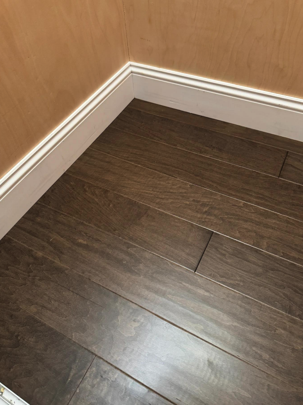New hardwood flooring installed in a residential elevator cab by Concept Flooring in Atlanta, GA