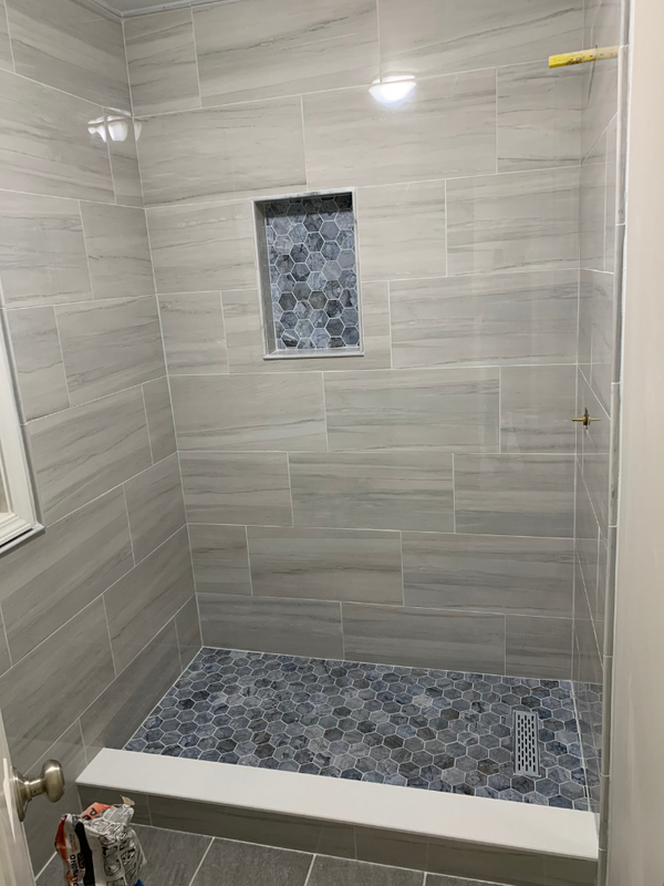 Tile samples and fixtures laid out for selection
