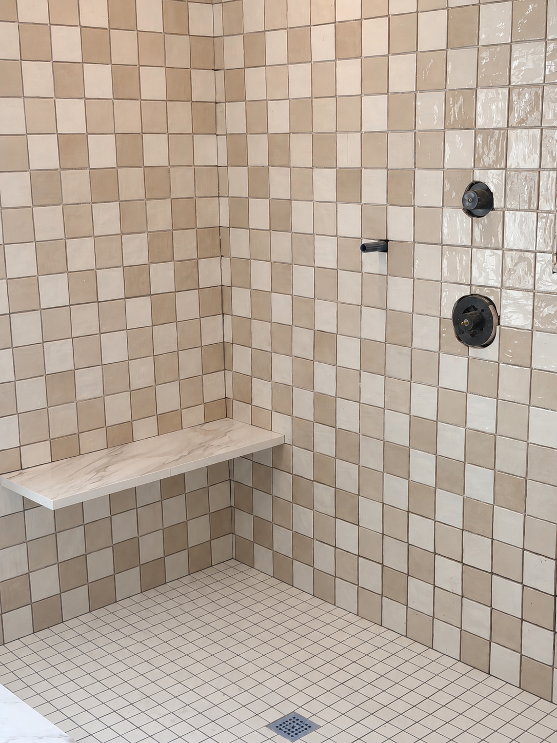 Three bathroom projects of different sizes, from a shower re-tile to a full primary bath