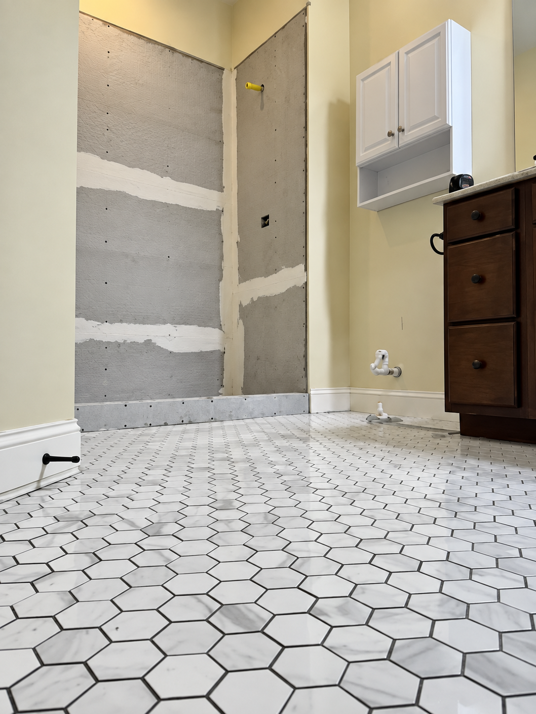 Tile samples and fixtures laid out for selection