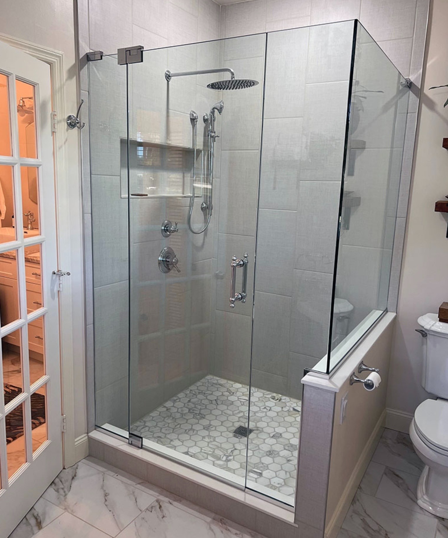 Fiberglass tub and shower removed and replaced with a new tiled walk-in shower