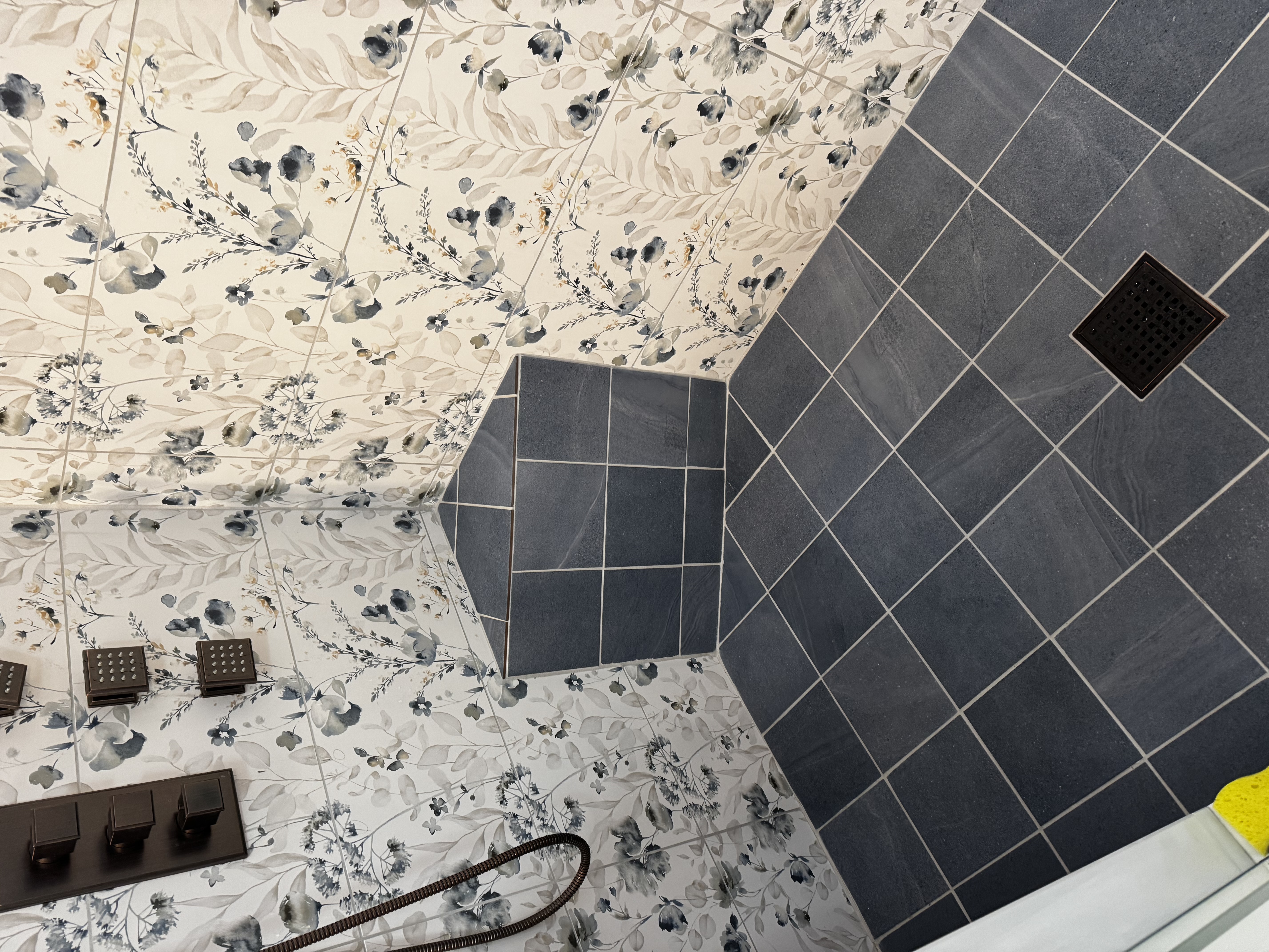 Bathroom mid-remodel with the shower, toilet and vanity kept in their original positions