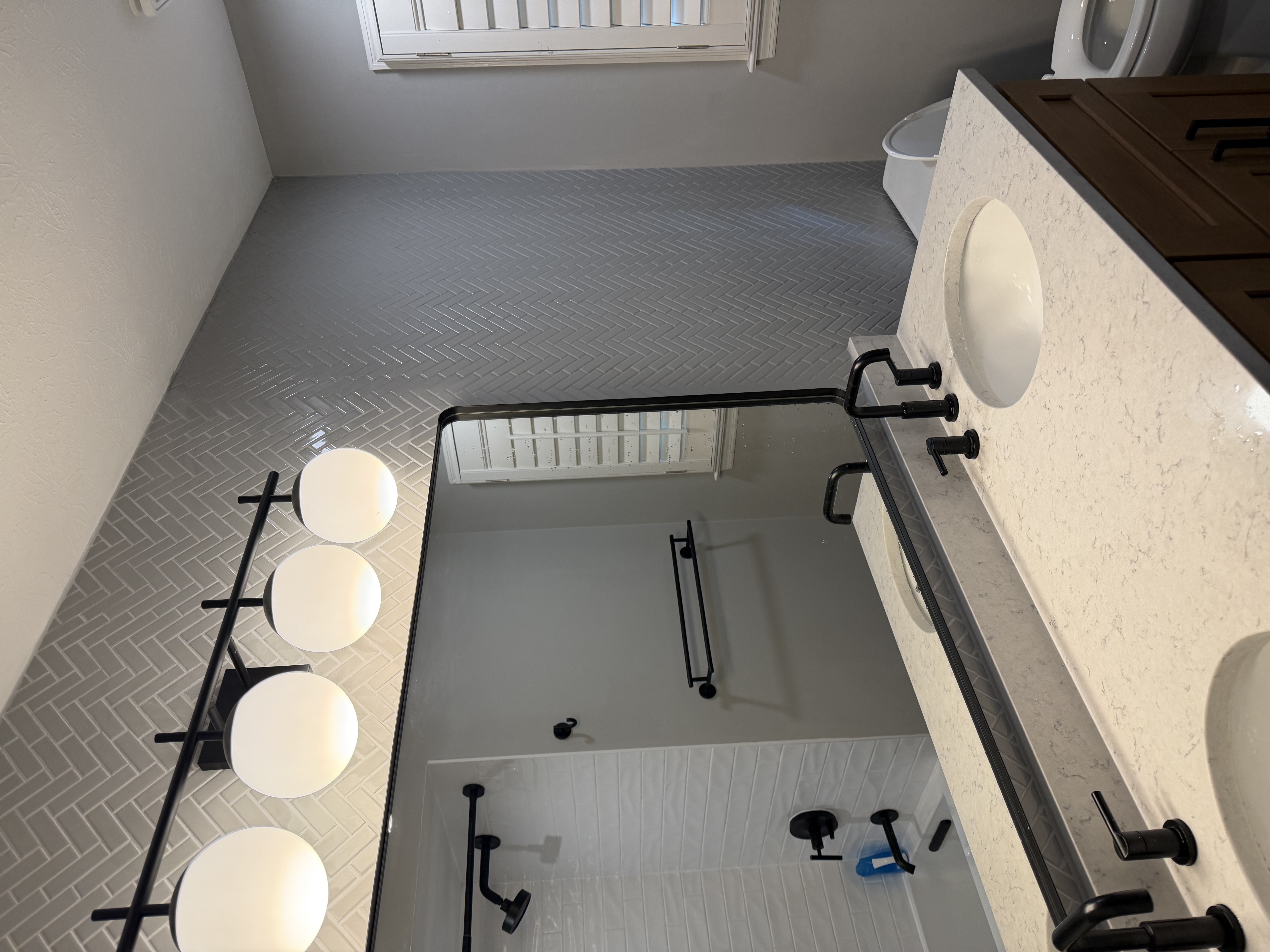 Bathroom mid-remodel with the shower, toilet and vanity kept in their original positions