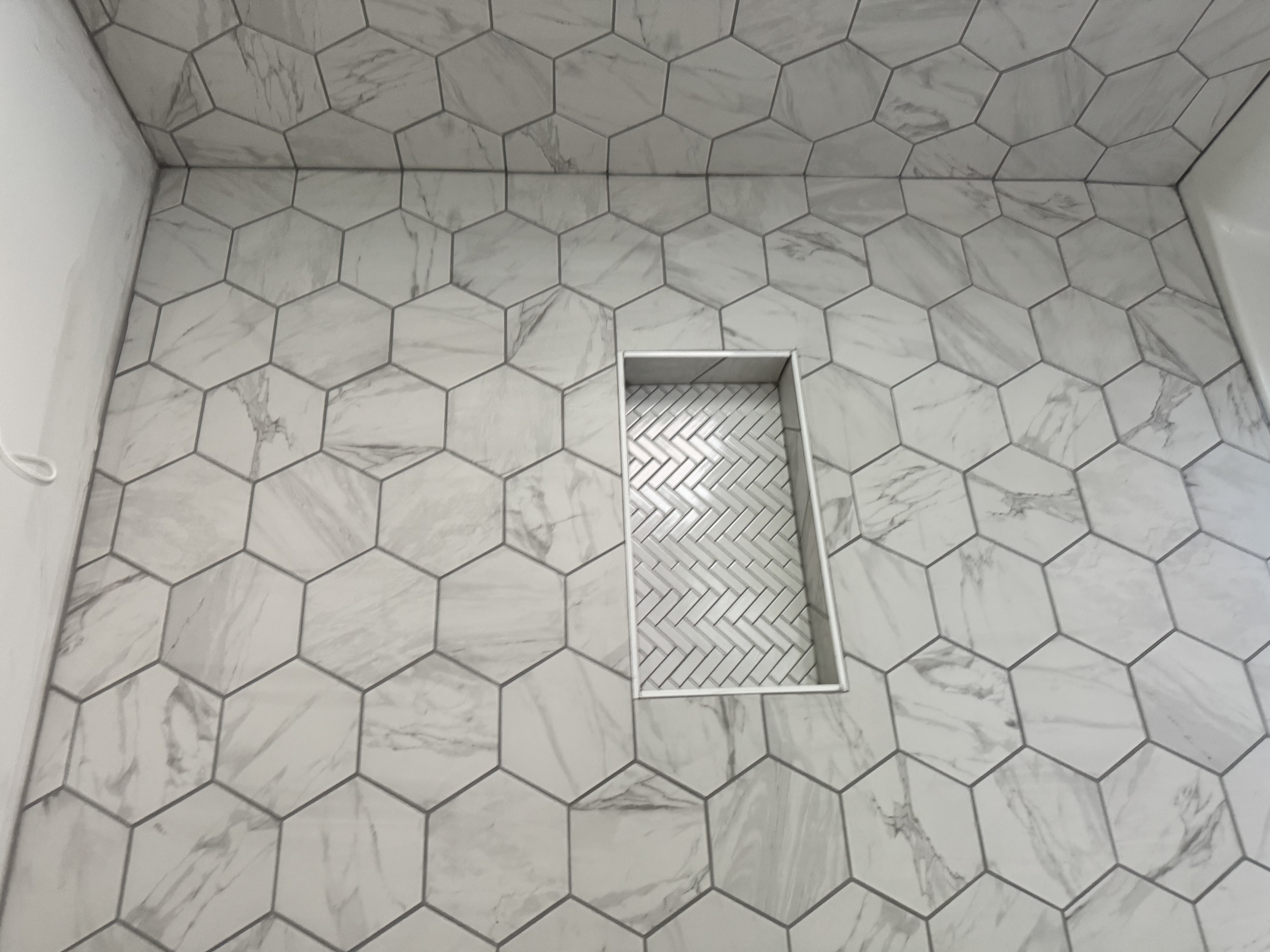 Tile samples and fixtures laid out for selection
