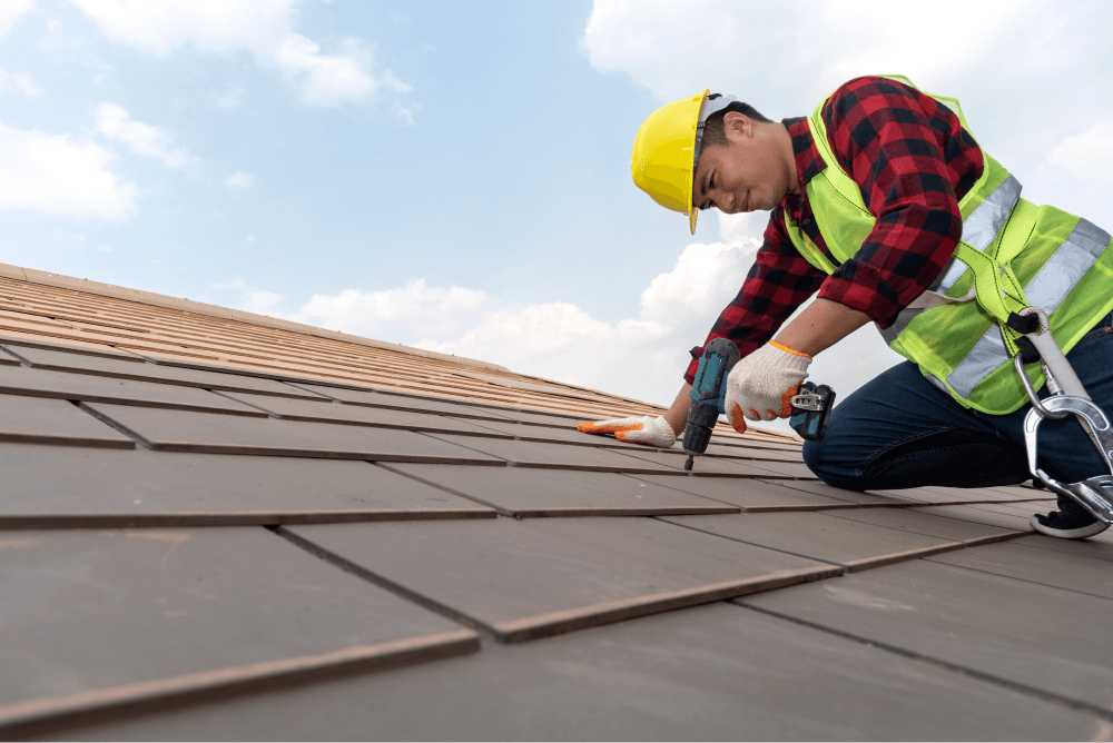 Roofer Installing New Roof Shingles