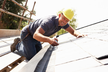 Roofer on Inspecting Roof