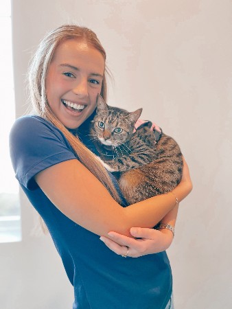 Raquel M holding a cat