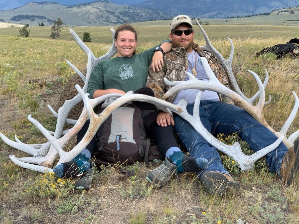 Sam T and family sitting with antlers