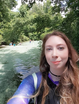Charlene D taking a selfie outside