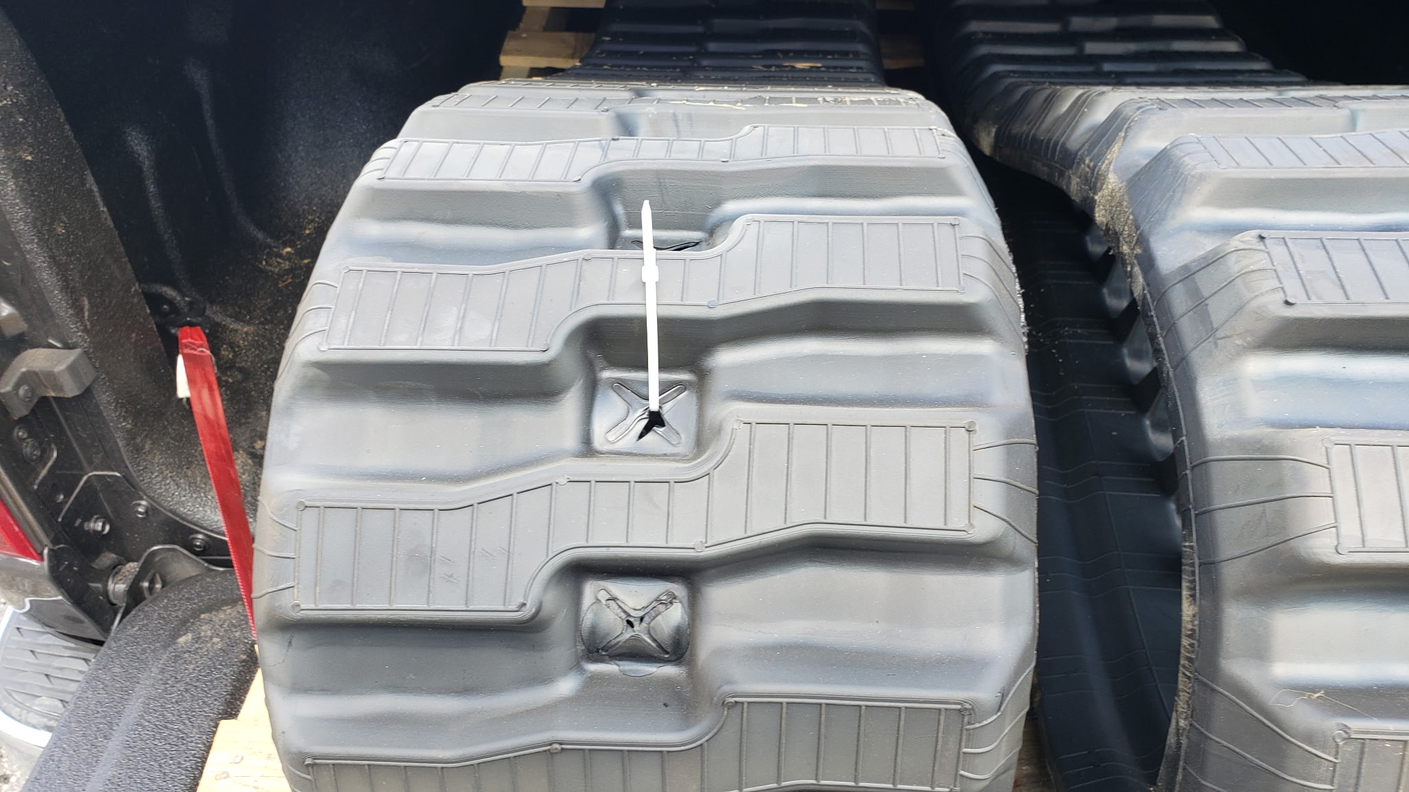 Skid steer rubber tracks replaced at a customer yard