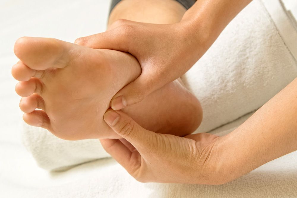 an individual experiencing foot pain