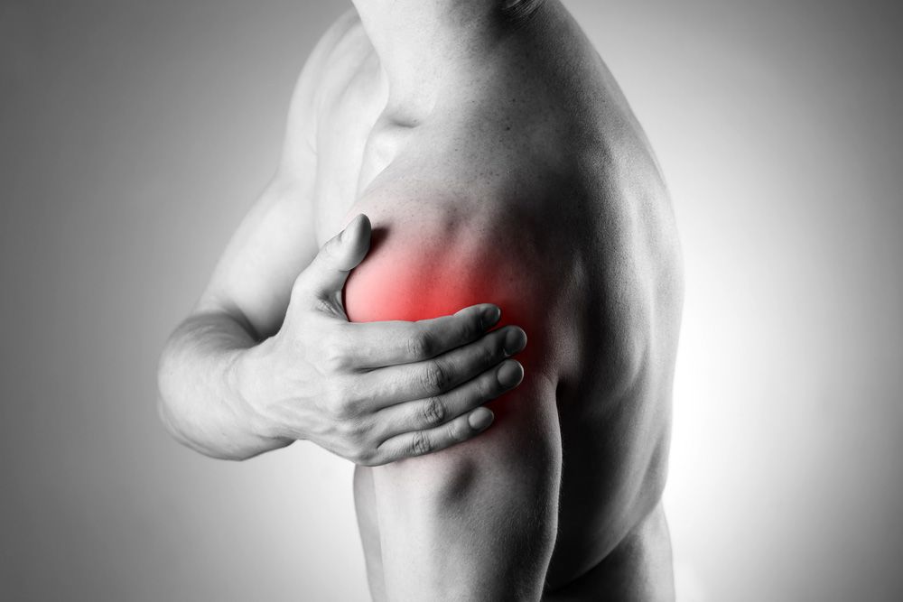 Image of man with shoulder pain highlighted in red