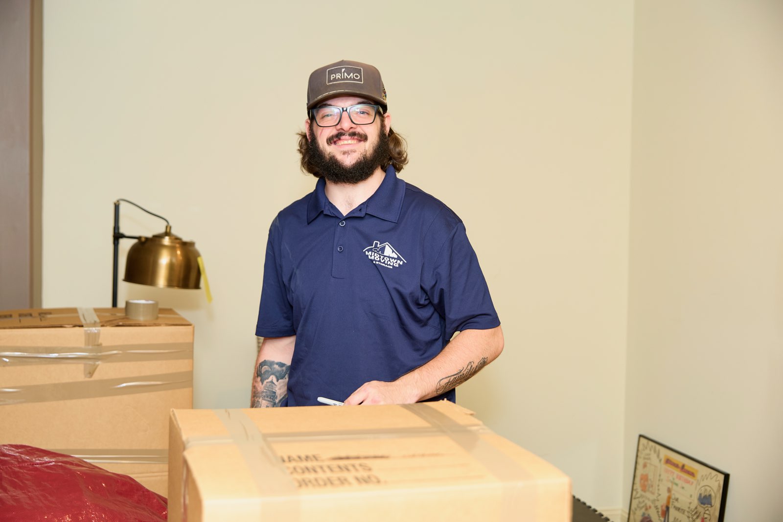 Midtown Moving crew member packing a box during a metro Atlanta move