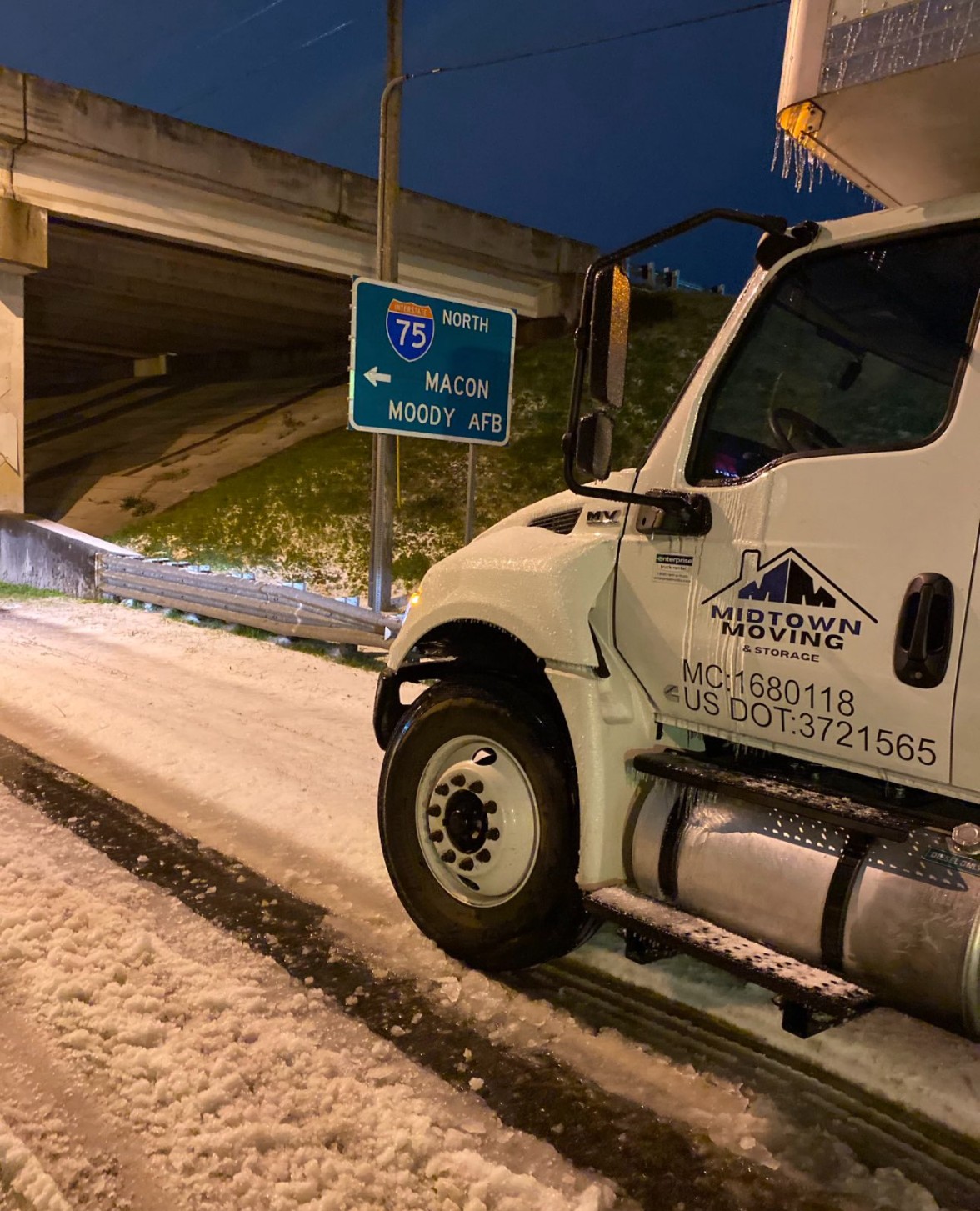Midtown Moving truck on a snowy highway during a long distance run to Macon