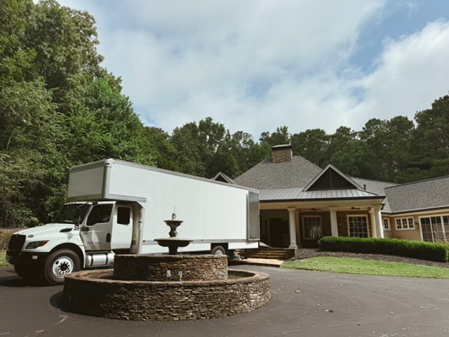 Midtown Moving box truck parked outside a home in Atlanta
