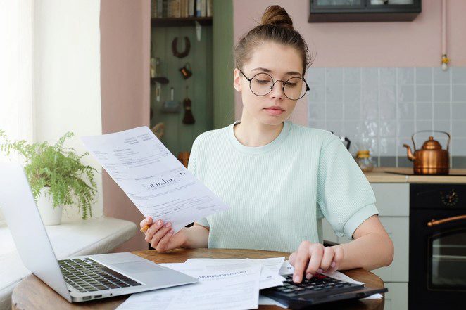 Woman Calculating Bills